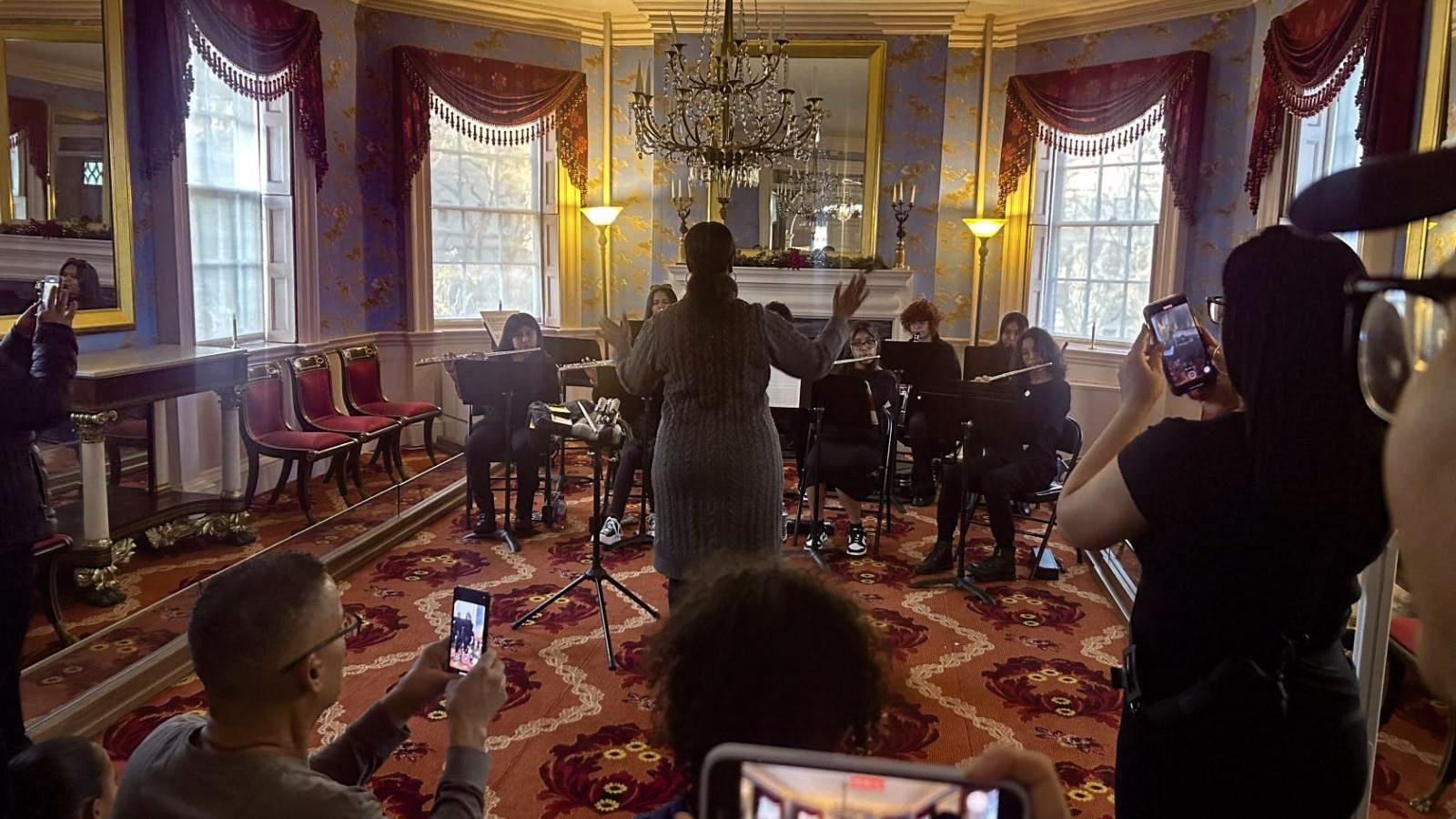 Individuals playing music and recording